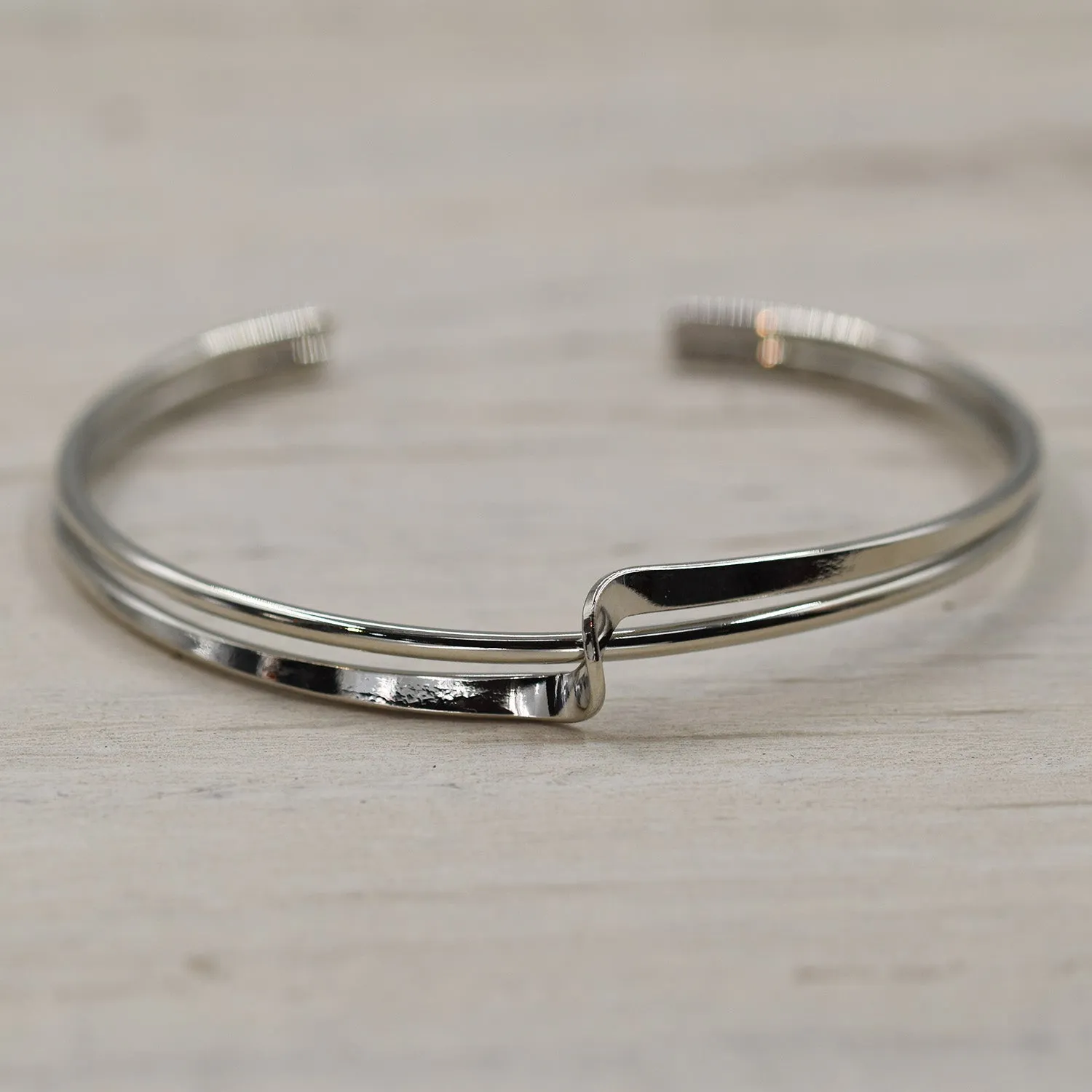 Double row open bracelet with simple twist